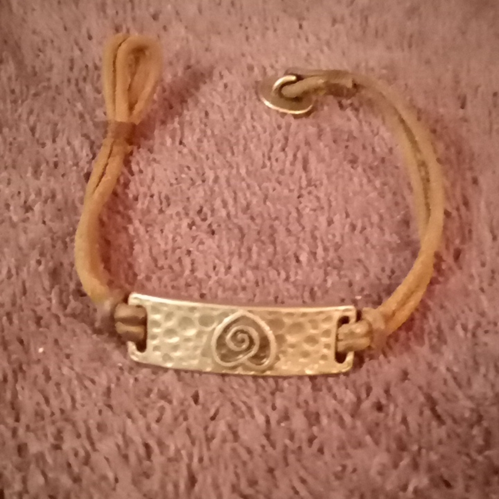 Leather bracelet w steel band w heart engraved in it